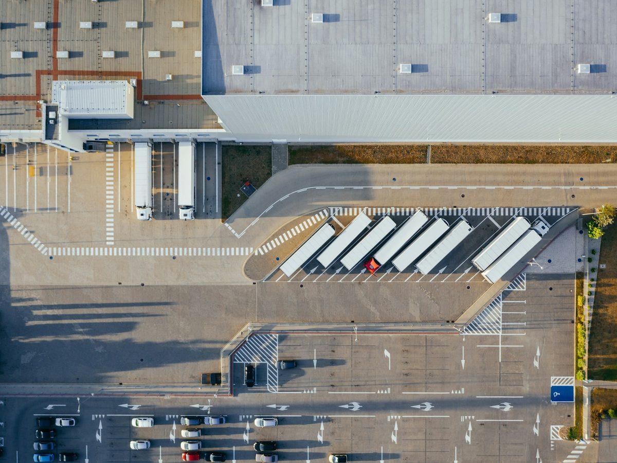 Aerial view of vehicles parked at an industrial facility